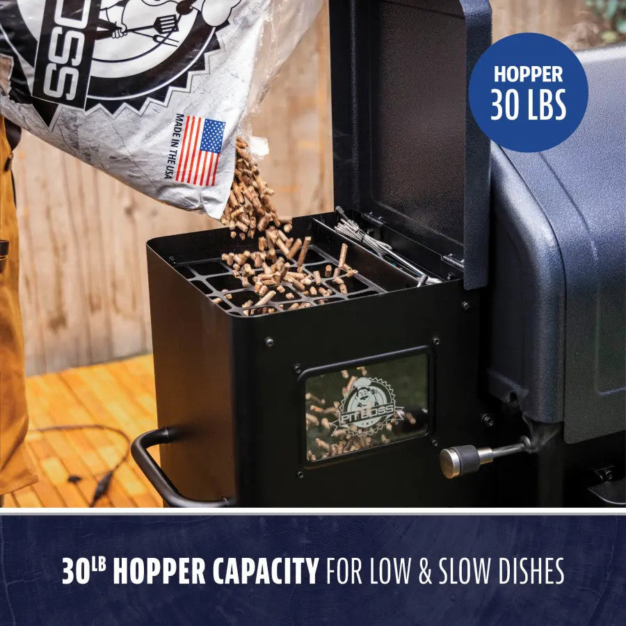 Pit Boss pellet grill with the hopper lid open, showing wood pellets next to the auger feed opening